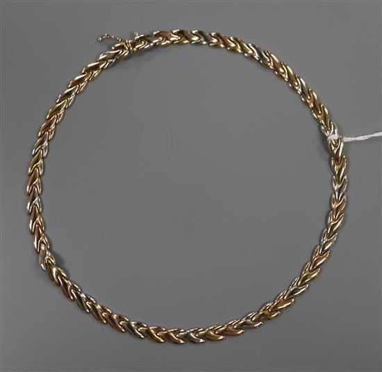 A 9ct tri-colour gold close fancy-link necklace with box clasp and safety chain, 14 grams.